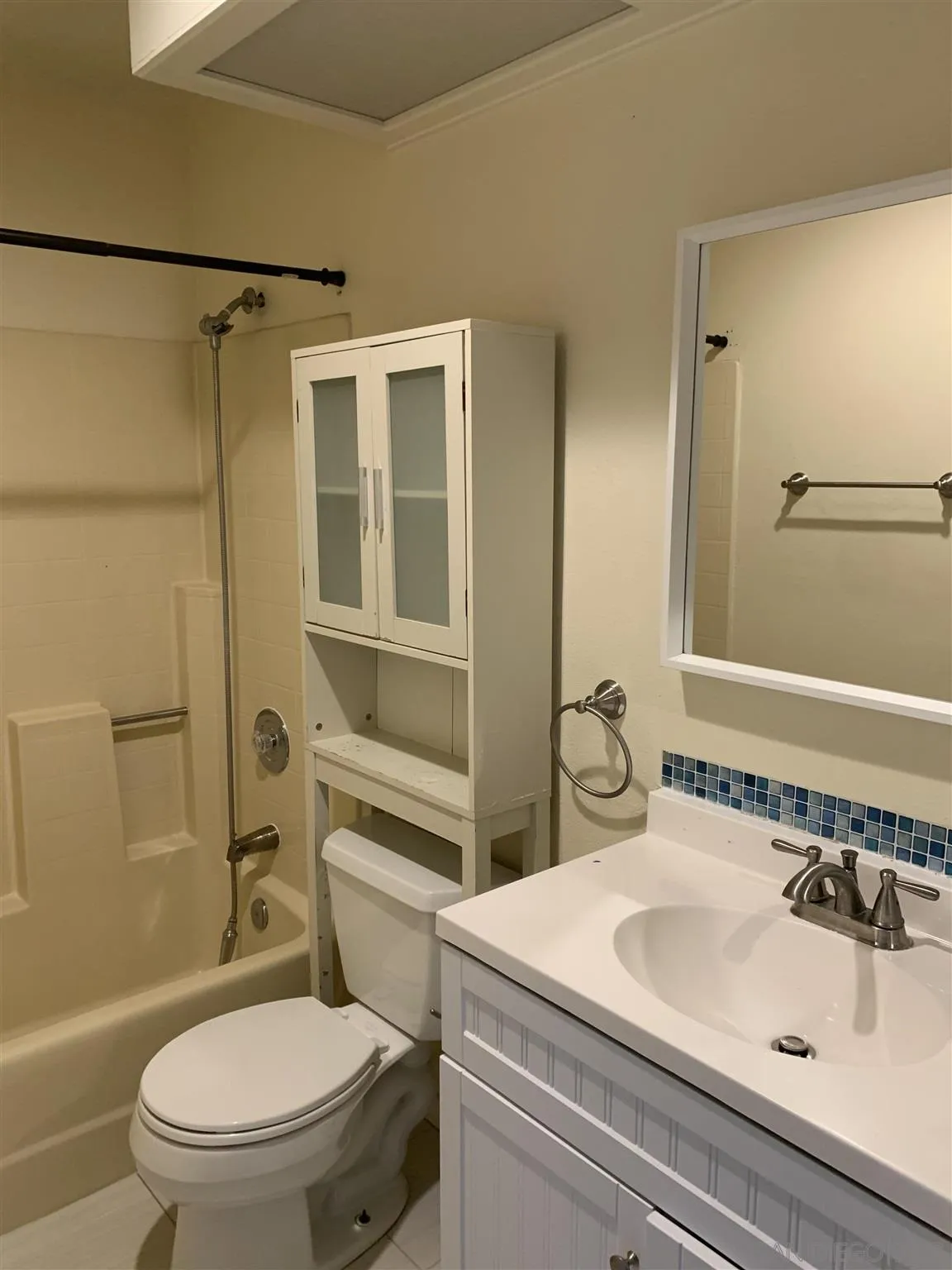 707 Brookstone Road, Unit 101 Chula Vista, CA 91913 - Photo 6 of 7 a bathroom with a sink toilet and shower