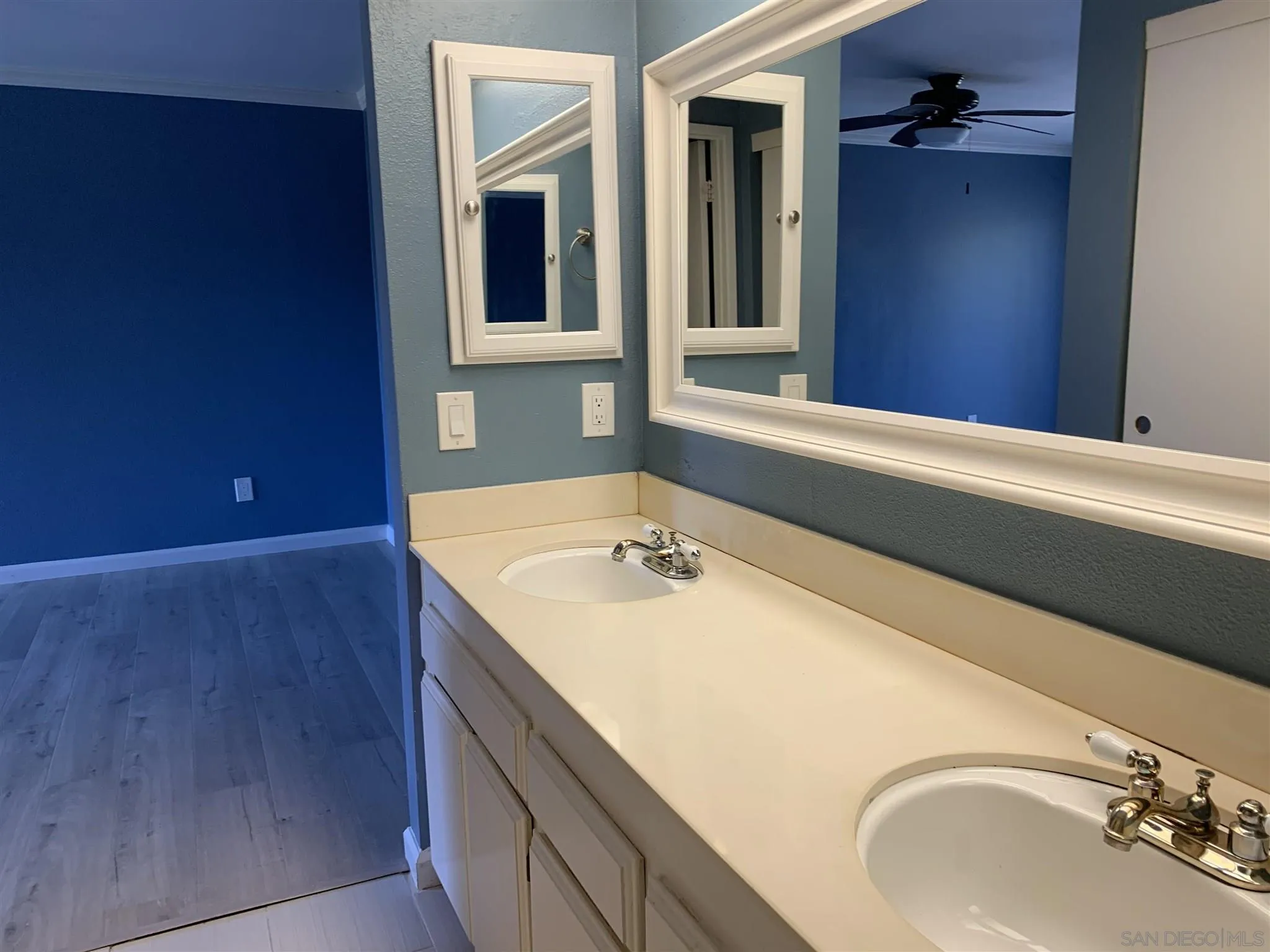 707 Brookstone Road, Unit 101 Chula Vista, CA 91913 - Photo 7 of 7 a bathroom with a tub sink and mirror