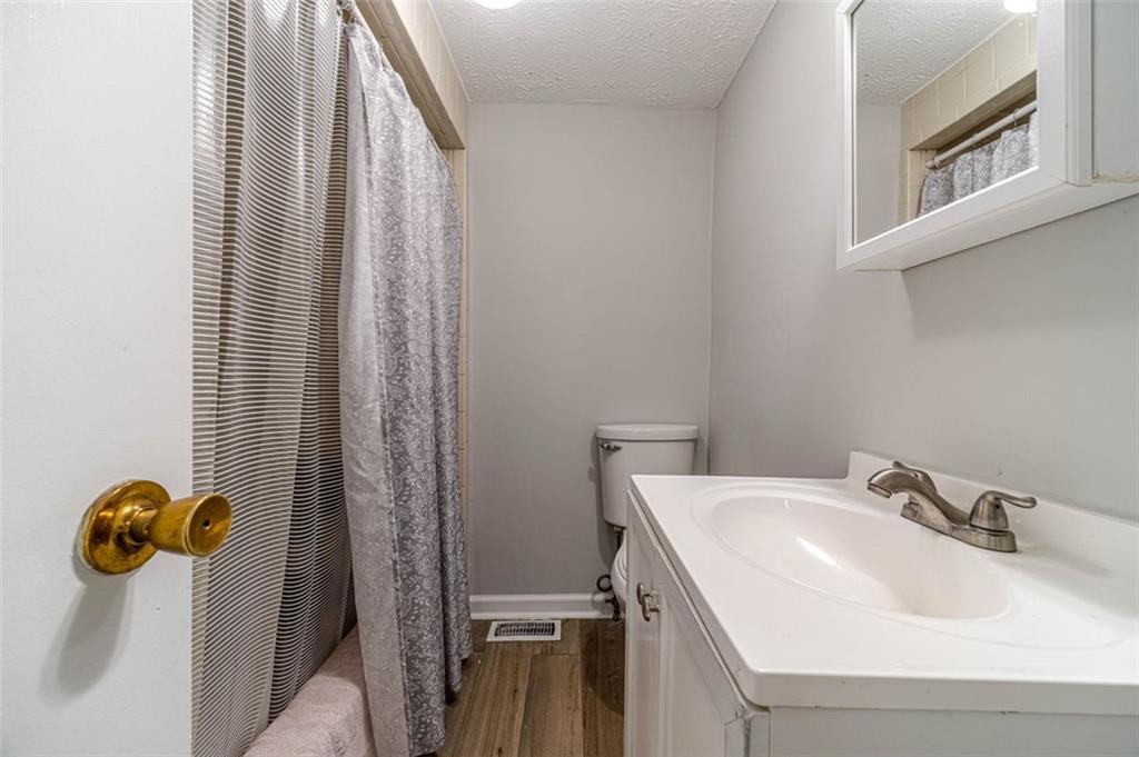 284 Covington Street Loganville, GA 30052 - Photo 13 of 55 a bathroom with a sink and mirror