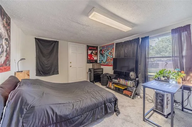 a view of staircase with a table and chairs