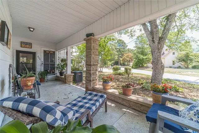 a view of a hallway with furniture and front door