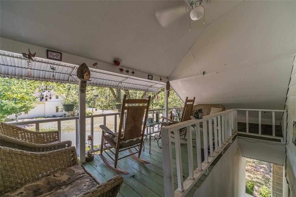 284 Covington Street Loganville, GA 30052 - Photo 21 of 55 a view of staircase with a table and chairs