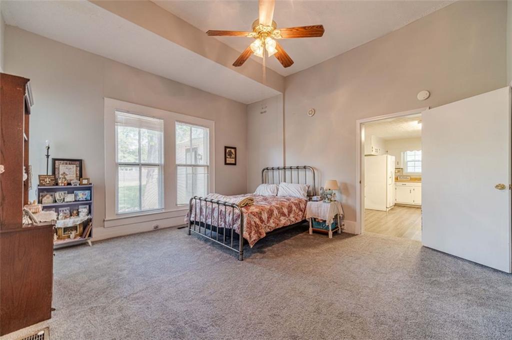 284 Covington Street Loganville, GA 30052 - Photo 3 of 55 a bed room with a bed and a chandelier