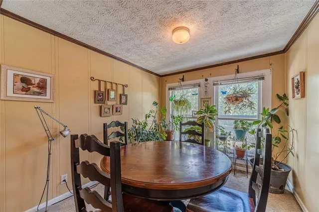 a bedroom with a bed a table and chair