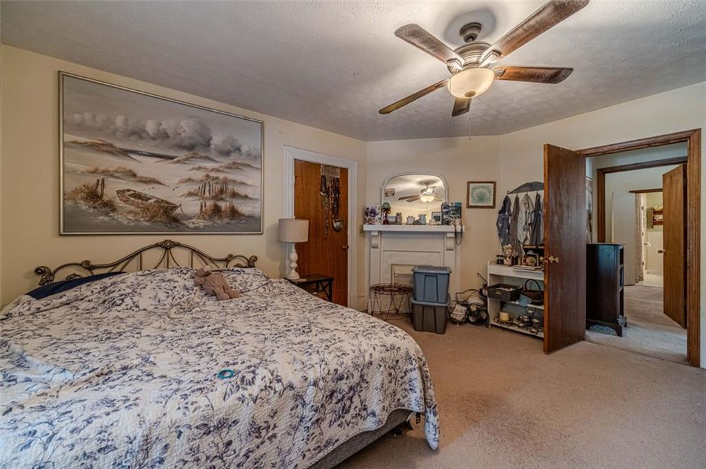 284 Covington Street Loganville, GA 30052 - Photo 36 of 55 a bedroom with a bed a table and chair