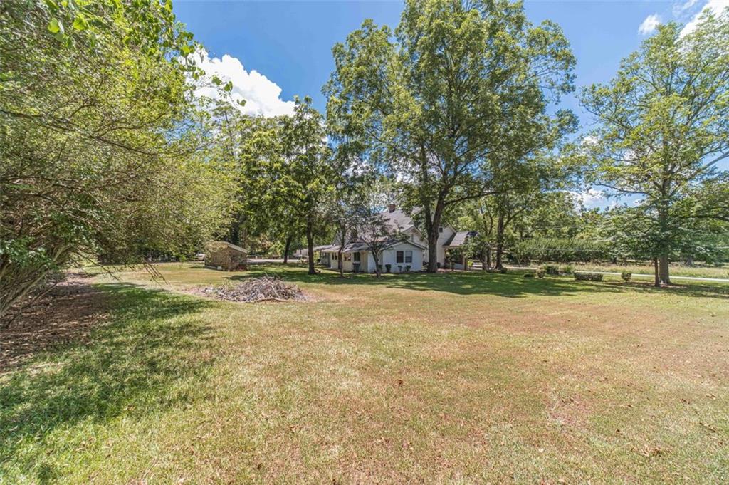 284 Covington Street Loganville, GA 30052 - Photo 45 of 55 a view of yard with trees