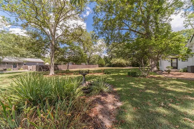 a view of a road with trees in front of it