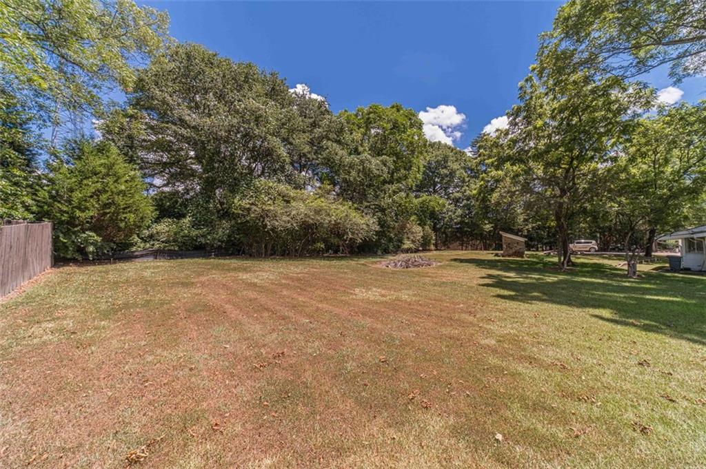 284 Covington Street Loganville, GA 30052 - Photo 51 of 55 a view of a field with trees