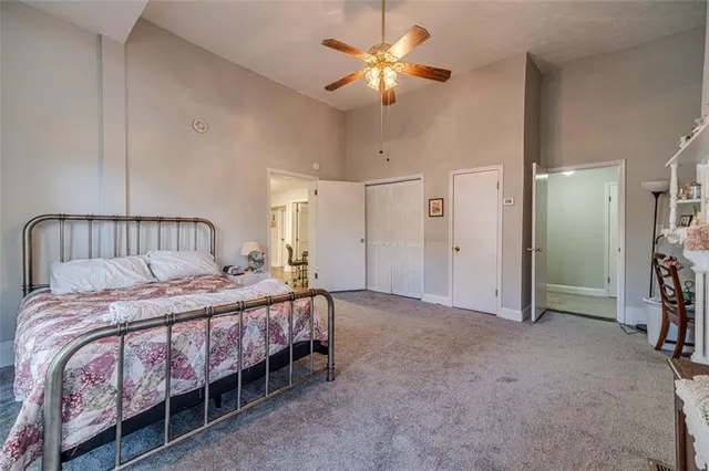 a view of a house with backyard sitting area and garden