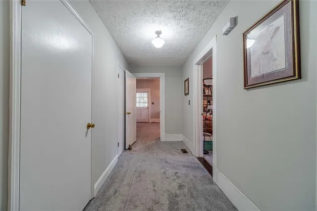 a kitchen with cabinets appliances and a window