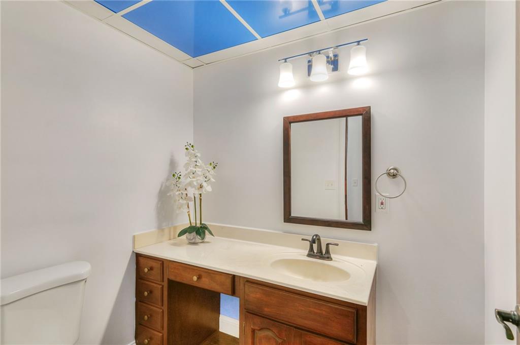 11070 Buchanan Highway Temple, GA 30179 - Photo 11 of 32 a bathroom with a sink and a mirror