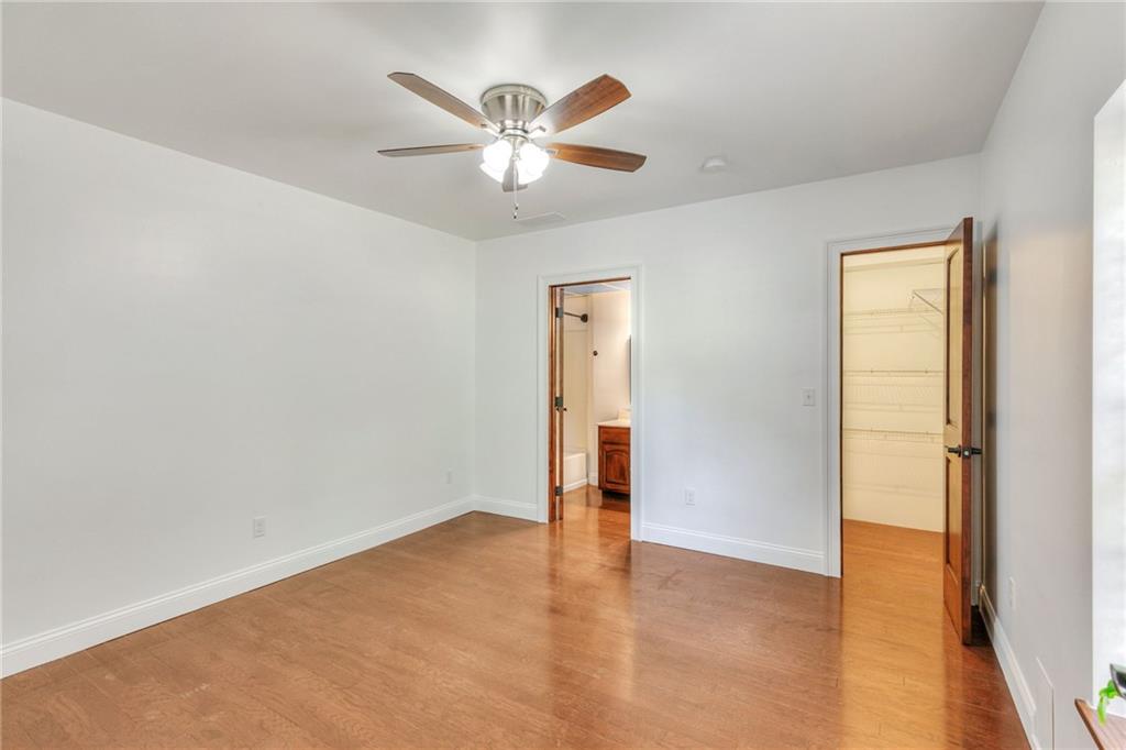 11070 Buchanan Highway Temple, GA 30179 - Photo 14 of 32 an empty room with closet and a chandelier fan