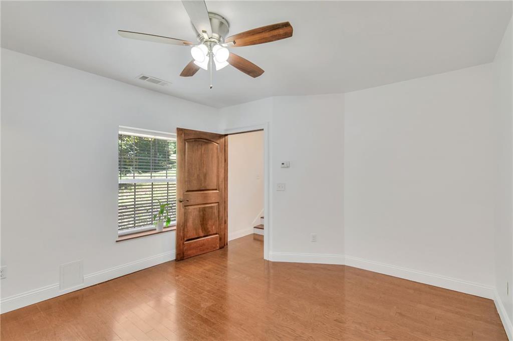 11070 Buchanan Highway Temple, GA 30179 - Photo 15 of 32 an empty room with windows and fan