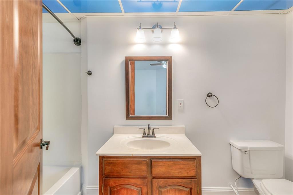 11070 Buchanan Highway Temple, GA 30179 - Photo 16 of 32 a bathroom with a sink and a mirror