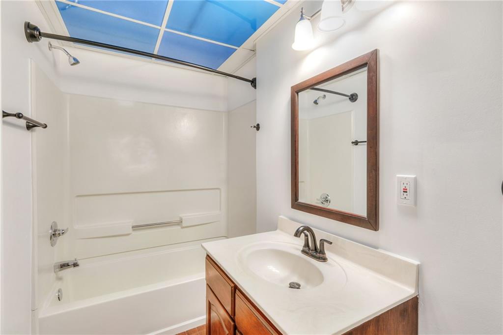 11070 Buchanan Highway Temple, GA 30179 - Photo 17 of 32 a bathroom with a sink and a bathtub