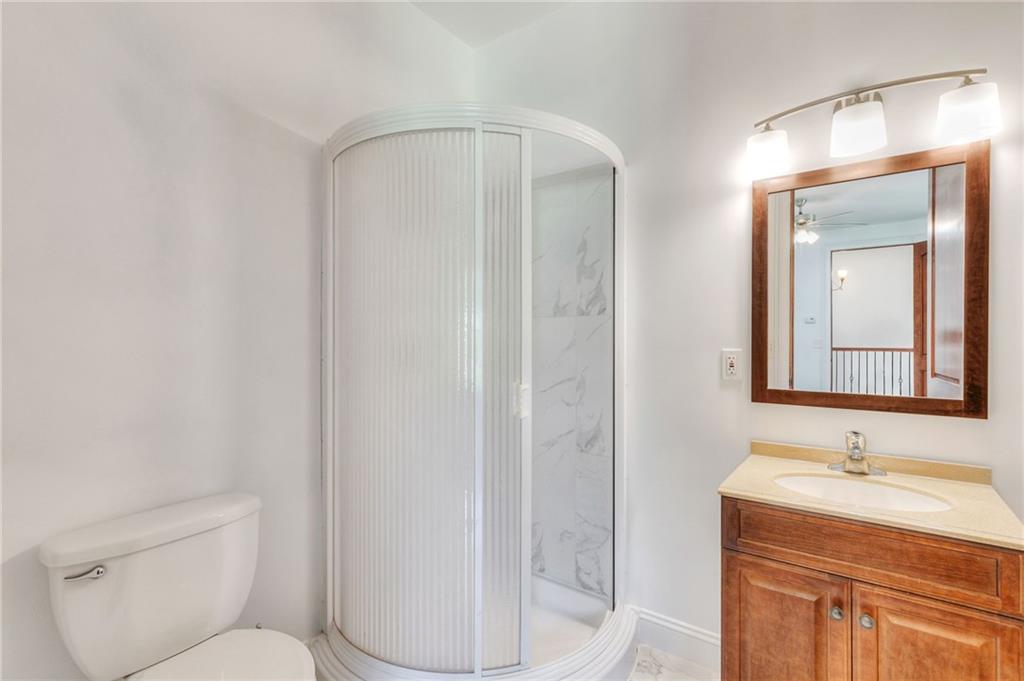 11070 Buchanan Highway Temple, GA 30179 - Photo 22 of 32 a bathroom with a granite countertop sink toilet and shower