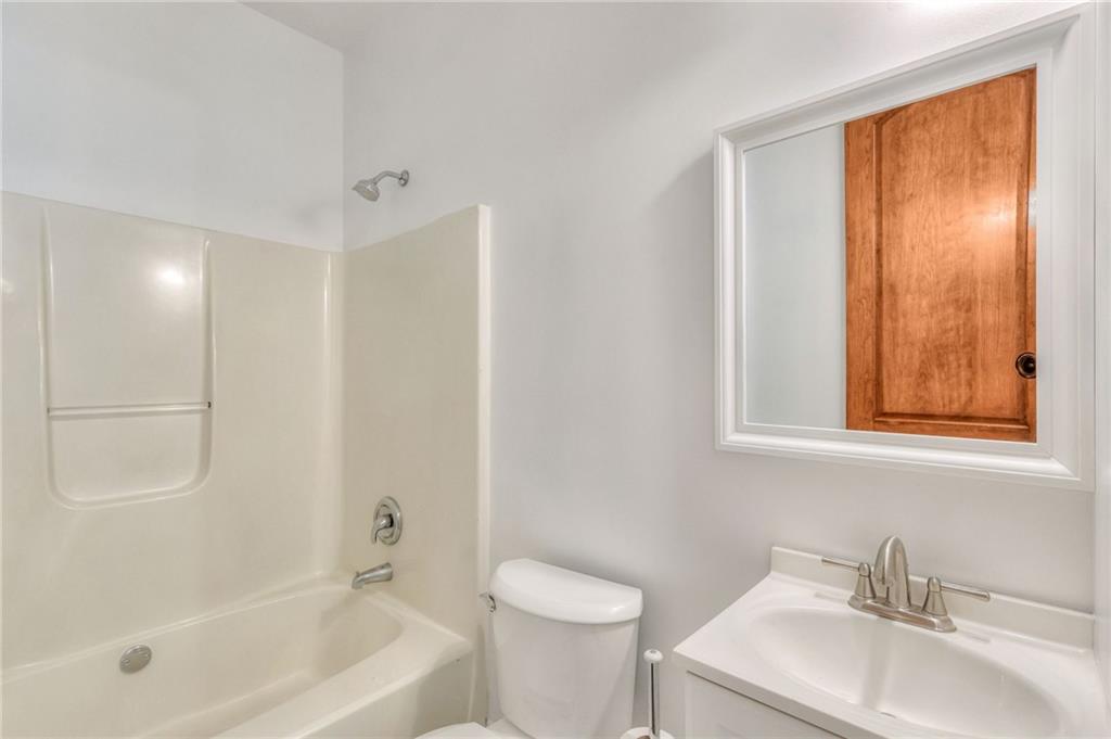 11070 Buchanan Highway Temple, GA 30179 - Photo 24 of 32 a bathroom with a sink toilet and shower