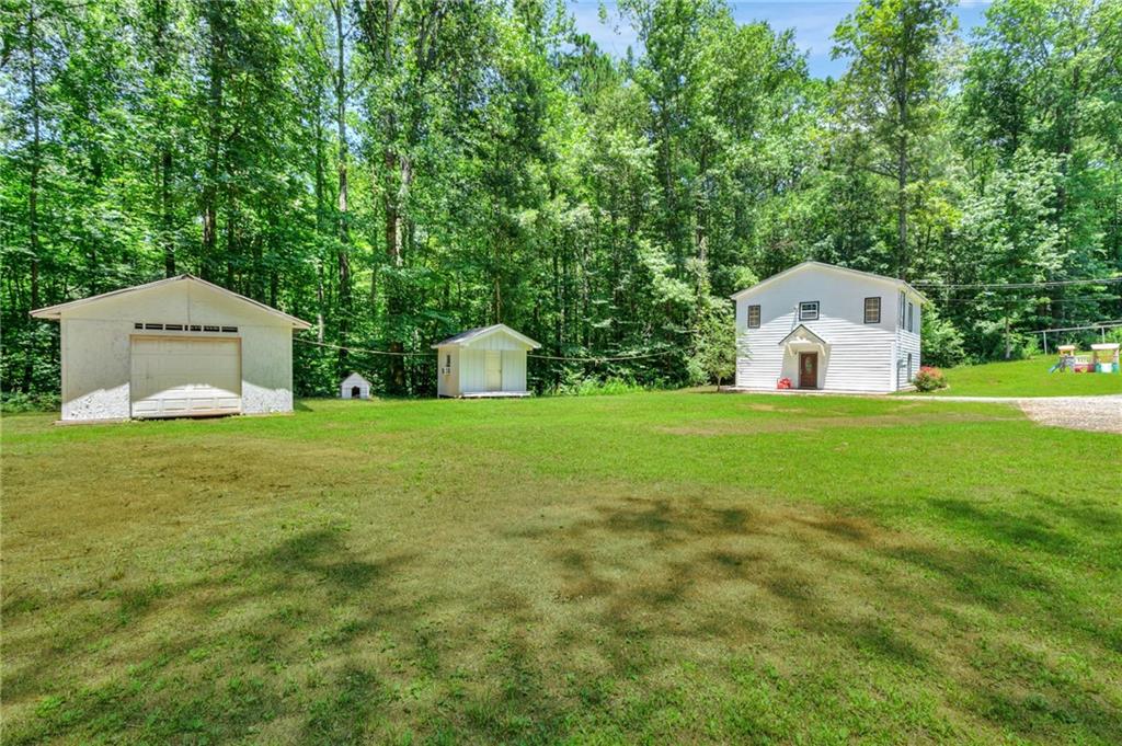 11070 Buchanan Highway Temple, GA 30179 - Photo 28 of 32 a house view with a garden space