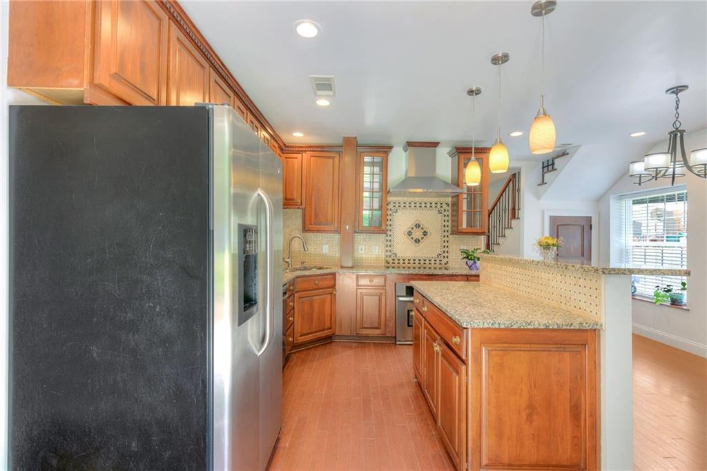 11070 Buchanan Highway Temple, GA 30179 - Photo 5 of 32 a large kitchen with a sink a counter top space and stainless steel appliances