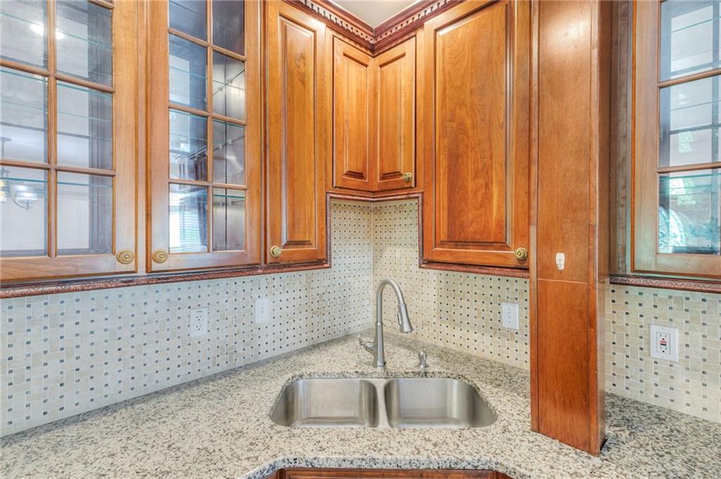 11070 Buchanan Highway Temple, GA 30179 - Photo 9 of 32 a kitchen with granite countertop a sink and a window