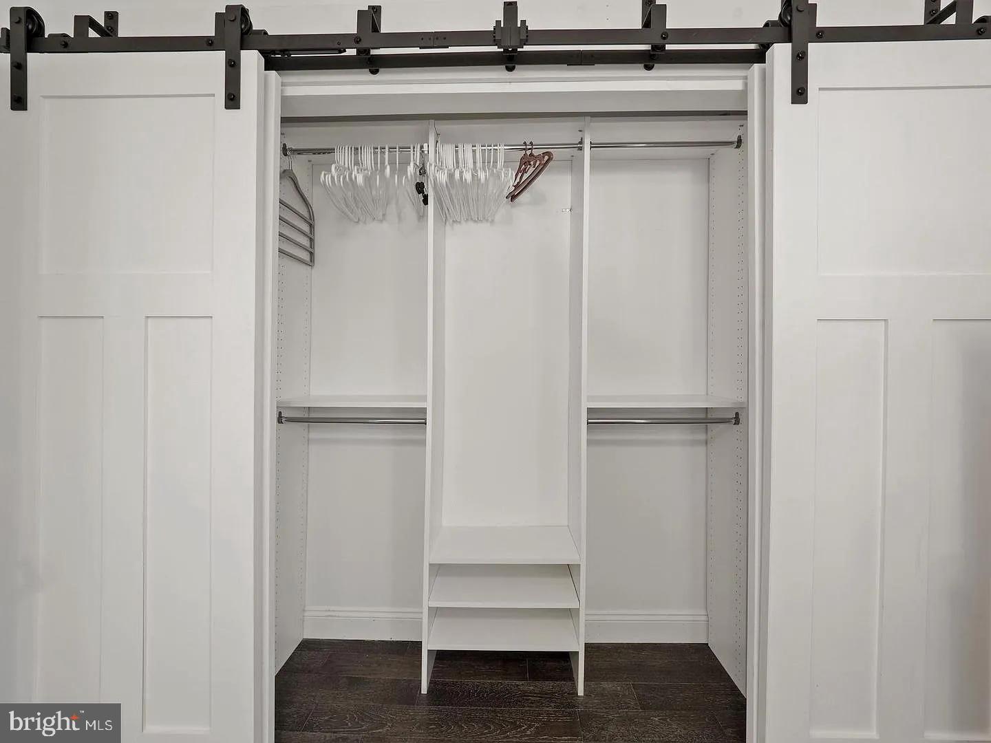 2605 Arcola Avenue Silver Spring, MD 20902 - Photo 16 of 30 Sleek, modern closet with sliding doors.