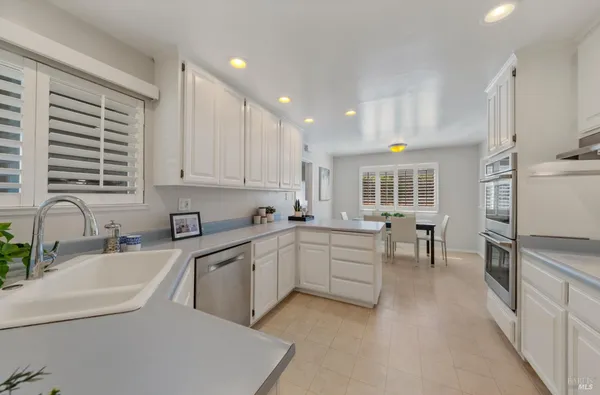 a kitchen with sink cabinets and window
