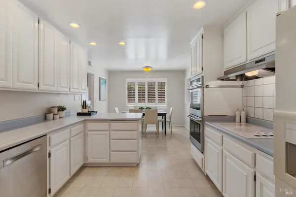 a kitchen with sink cabinets and window