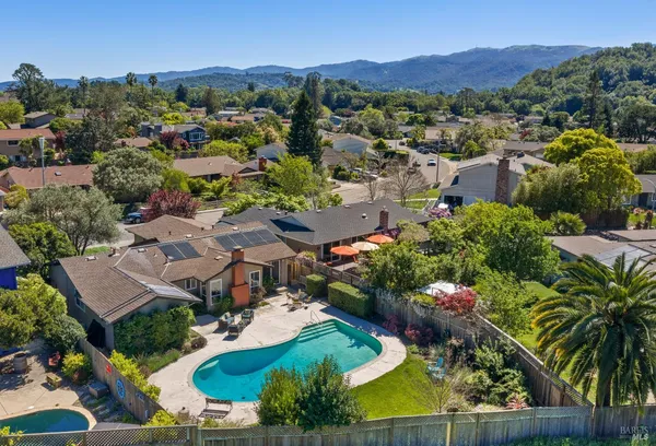 an aerial view of residential houses and outdoor space