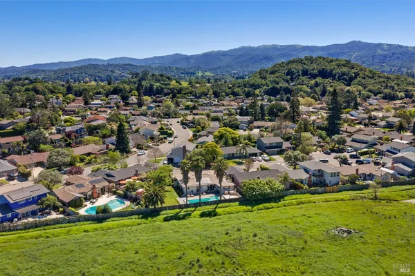 an aerial view of residential houses and outdoor space