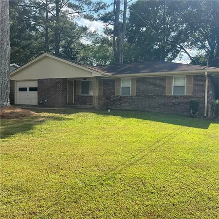 a view of a house with a yard