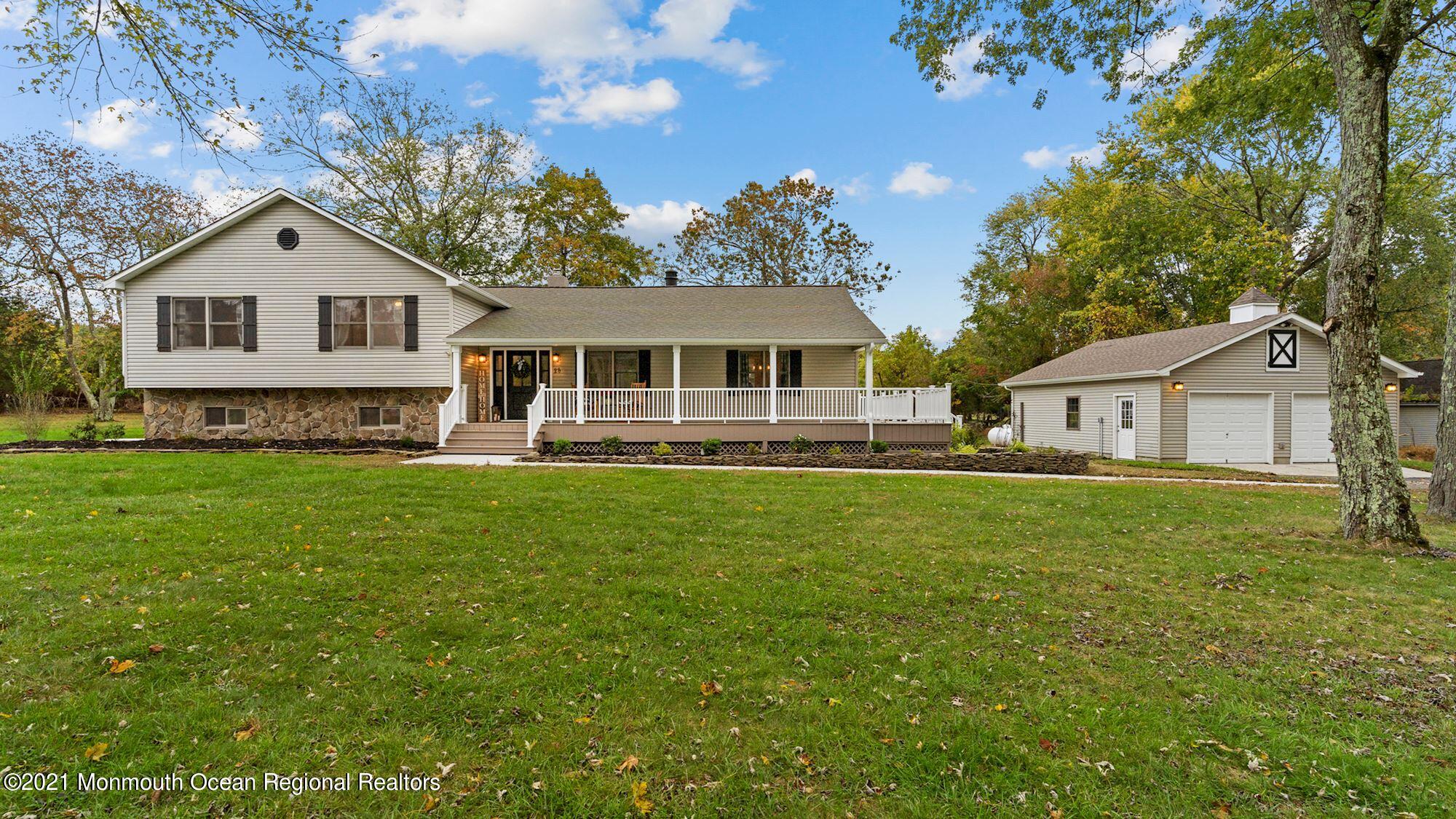 28 Driftway Road Howell, NJ 07731 - Photo 1 of 47 a front view of a house with a garden