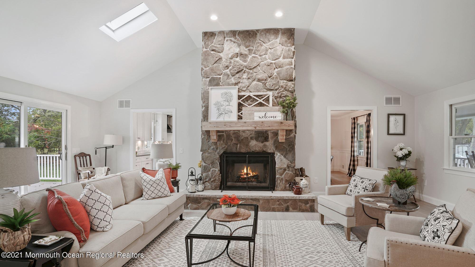 28 Driftway Road Howell, NJ 07731 - Photo 2 of 47 a living room with furniture and a fireplace
