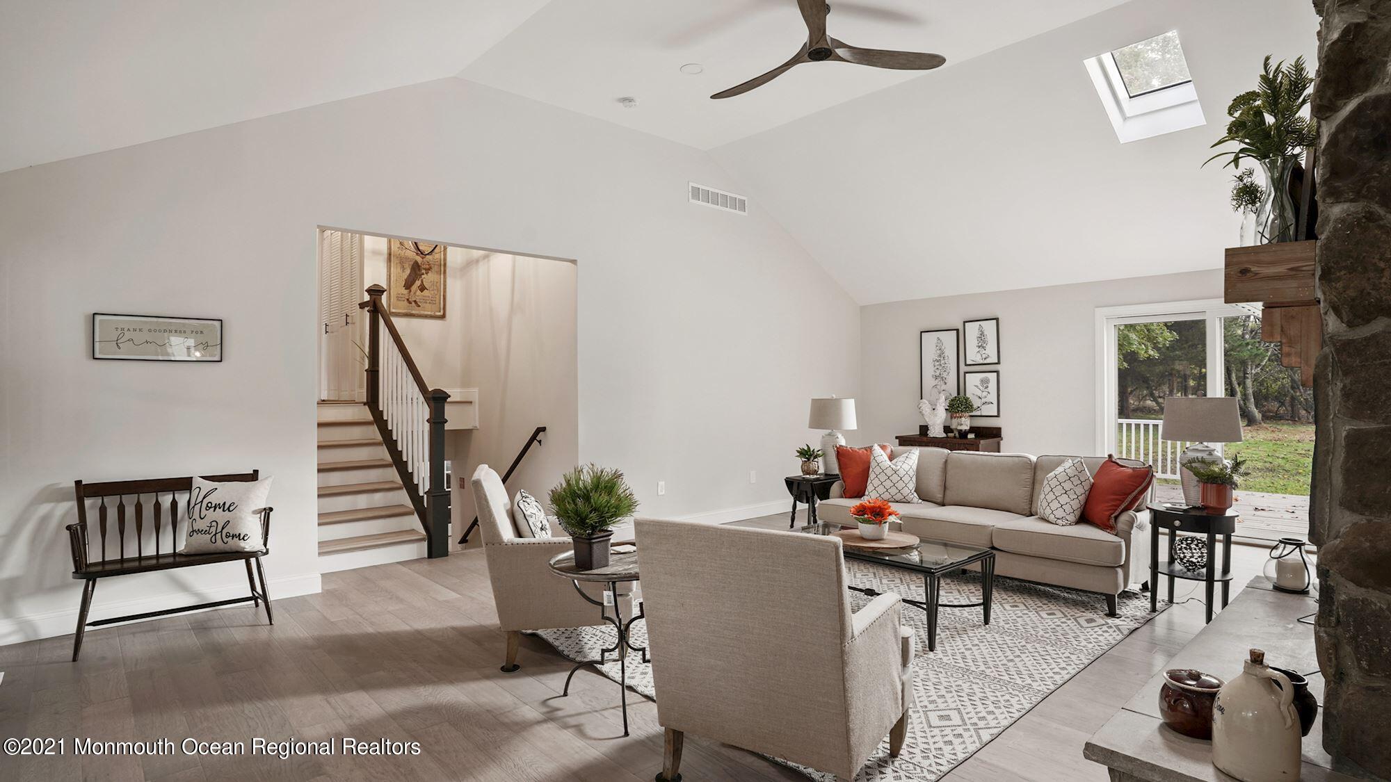 28 Driftway Road Howell, NJ 07731 - Photo 12 of 47 a living room with furniture and a potted plant