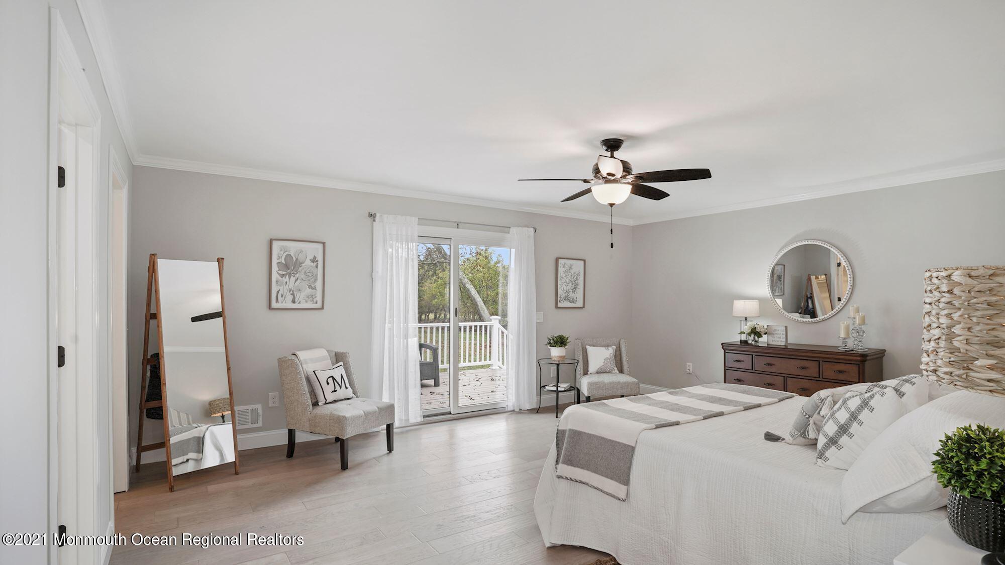 28 Driftway Road Howell, NJ 07731 - Photo 17 of 47 a living room with furniture and a chandelier