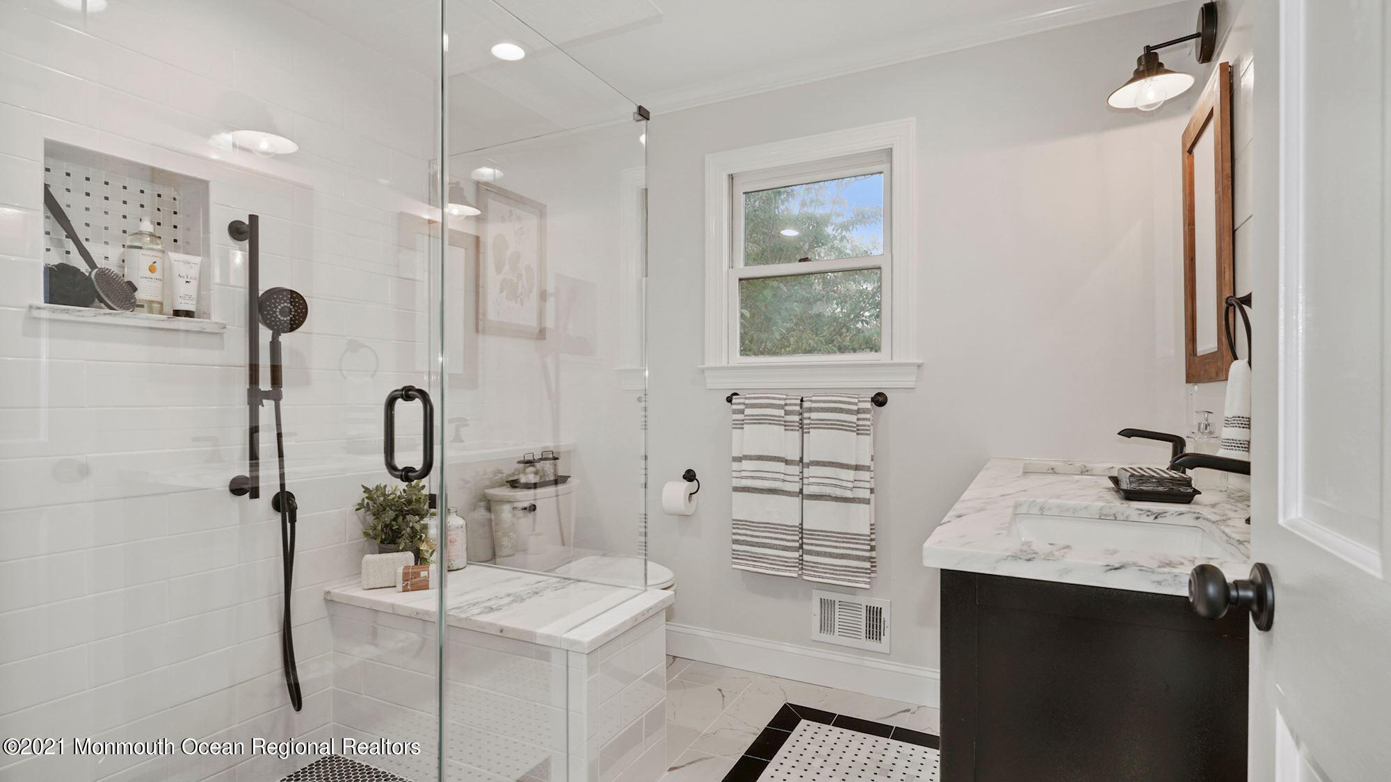 28 Driftway Road Howell, NJ 07731 - Photo 20 of 47 a bathroom with a sink toilet and shower