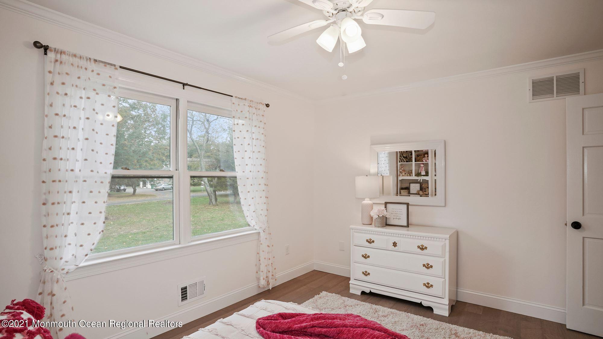 28 Driftway Road Howell, NJ 07731 - Photo 23 of 47 a bedroom with a bed and a window