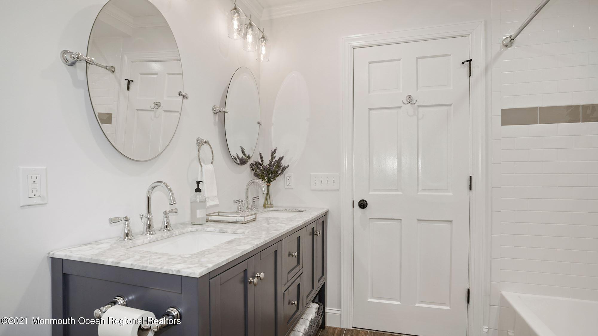 28 Driftway Road Howell, NJ 07731 - Photo 24 of 47 a bathroom with a sink vanity and a mirror