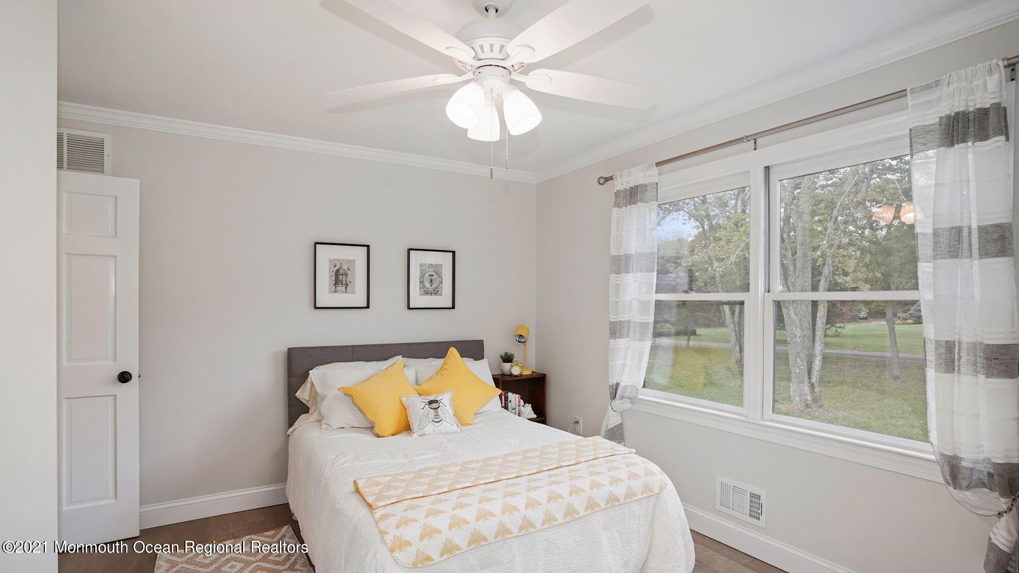 28 Driftway Road Howell, NJ 07731 - Photo 26 of 47 a bedroom with a large bed and a window