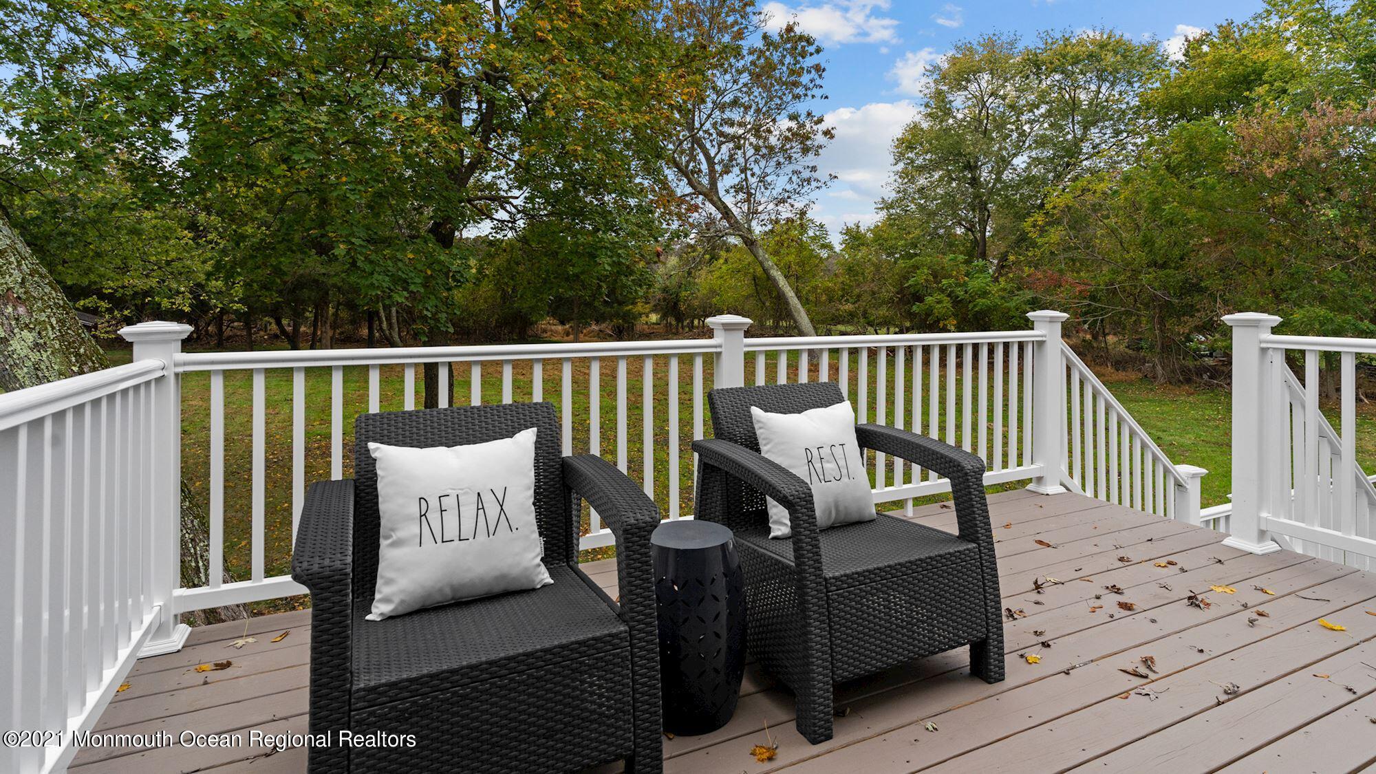 28 Driftway Road Howell, NJ 07731 - Photo 38 of 47 a view of a wooden deck with furniture