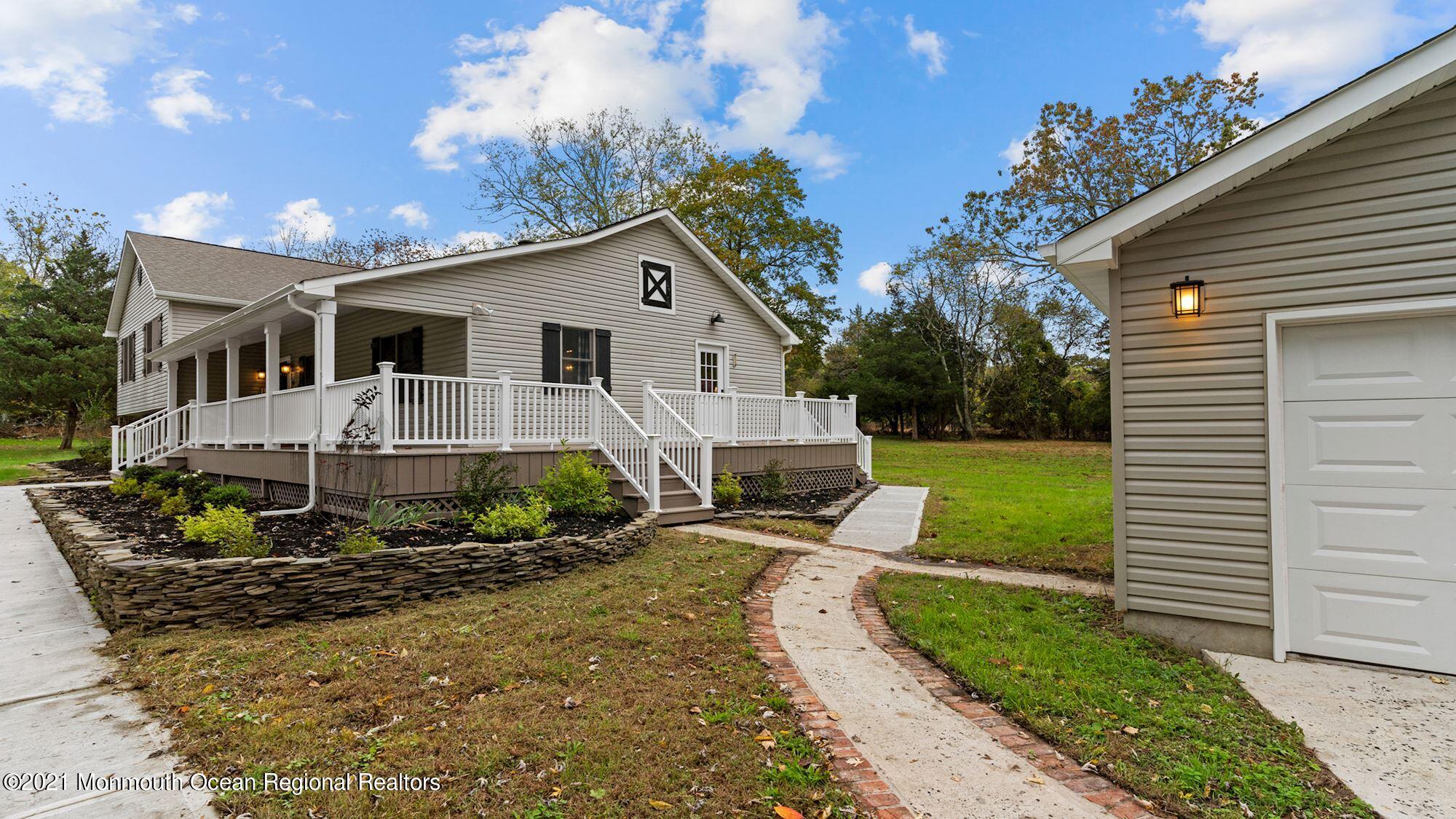 28 Driftway Road Howell, NJ 07731 - Photo 43 of 47 a view of a house with backyard and sitting area