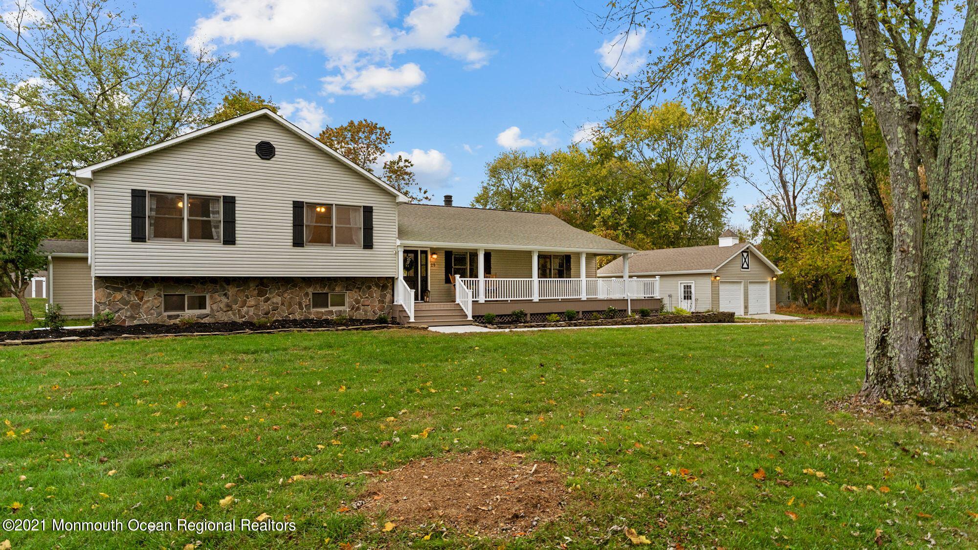 28 Driftway Road Howell, NJ 07731 - Photo 47 of 47 a front view of a house with a yard