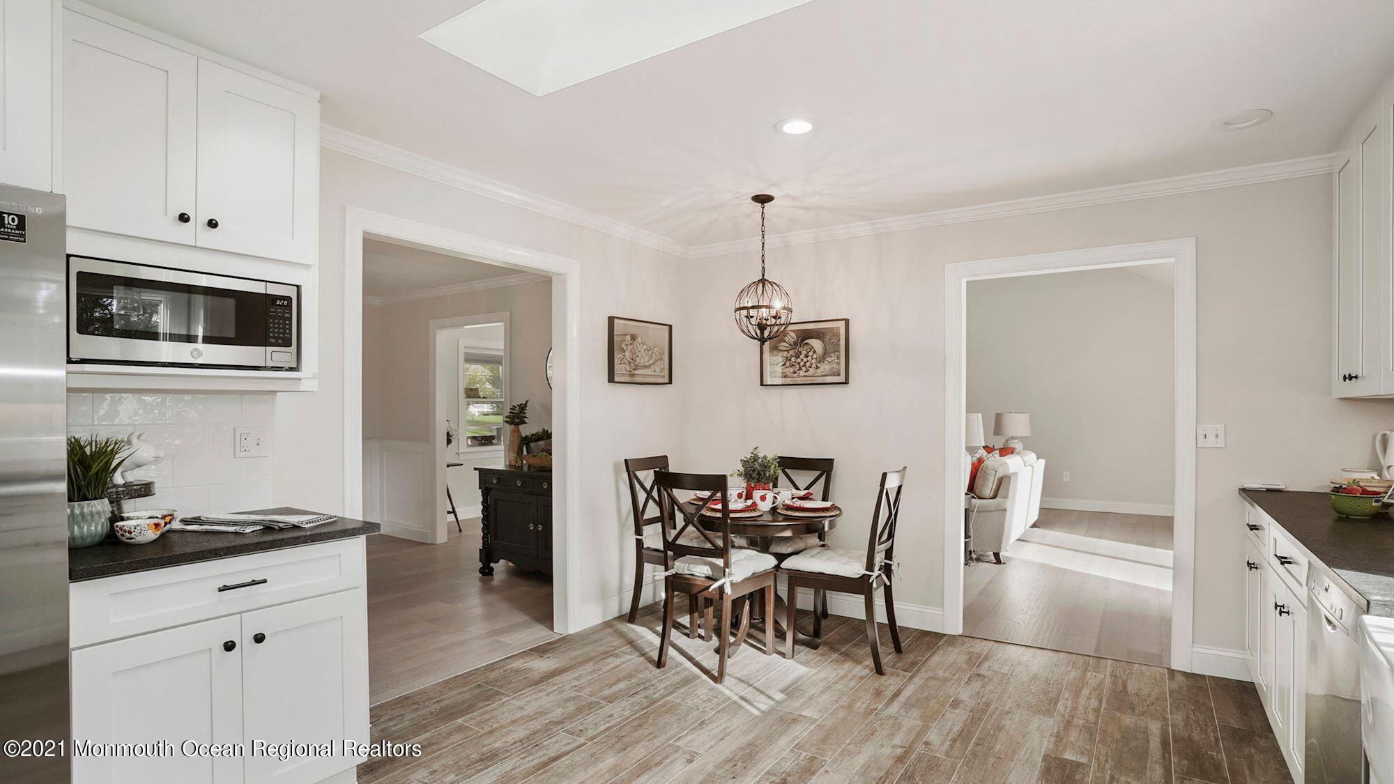28 Driftway Road Howell, NJ 07731 - Photo 7 of 47 a living room with furniture and wooden floor