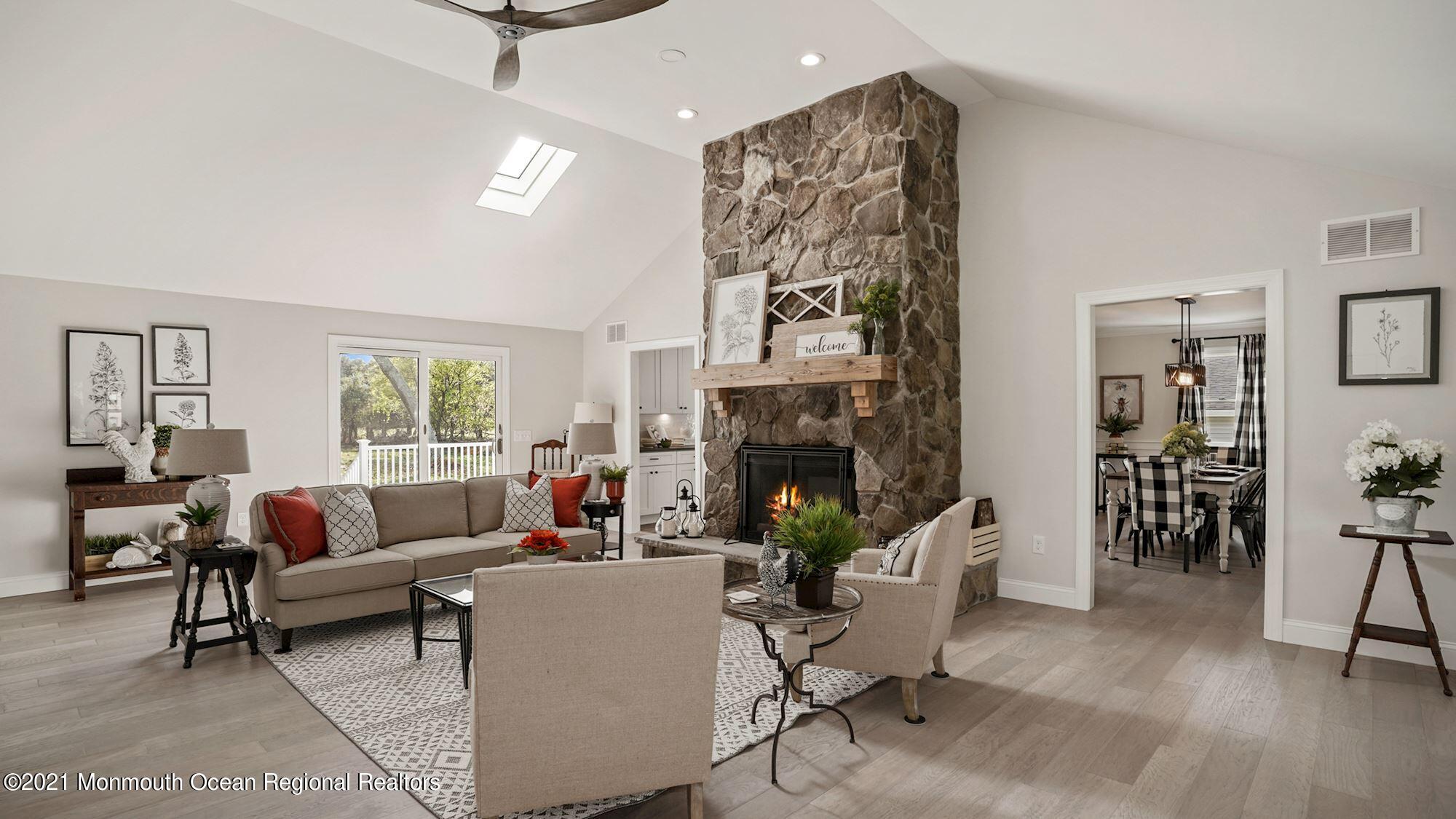 28 Driftway Road Howell, NJ 07731 - Photo 10 of 47 a living room with furniture and a fireplace