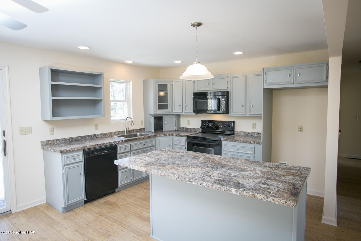 20 Cedar Road Mount Pocono, PA 18344 - Photo 11 of 43 a kitchen with stainless steel appliances granite countertop a refrigerator a stove top oven a sink and dishwasher with wooden floor