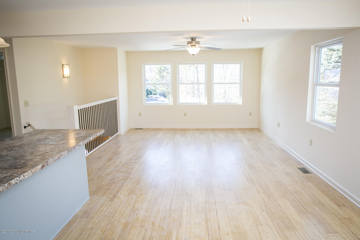 20 Cedar Road Mount Pocono, PA 18344 - Photo 17 of 43 an empty room with wooden floor and windows