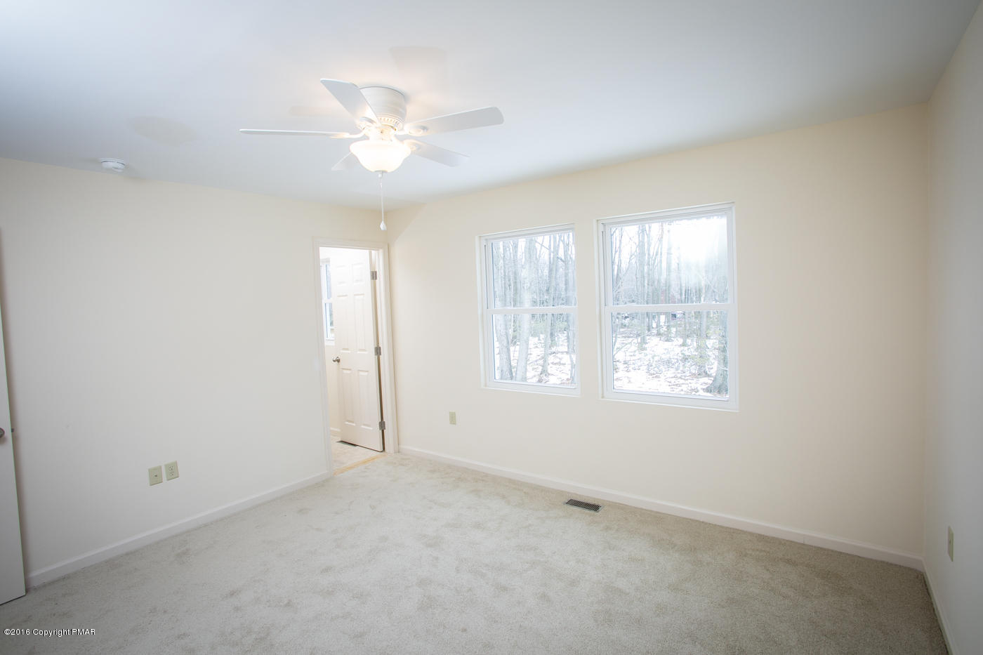 20 Cedar Road Mount Pocono, PA 18344 - Photo 23 of 43 an empty room with windows and chandelier fan