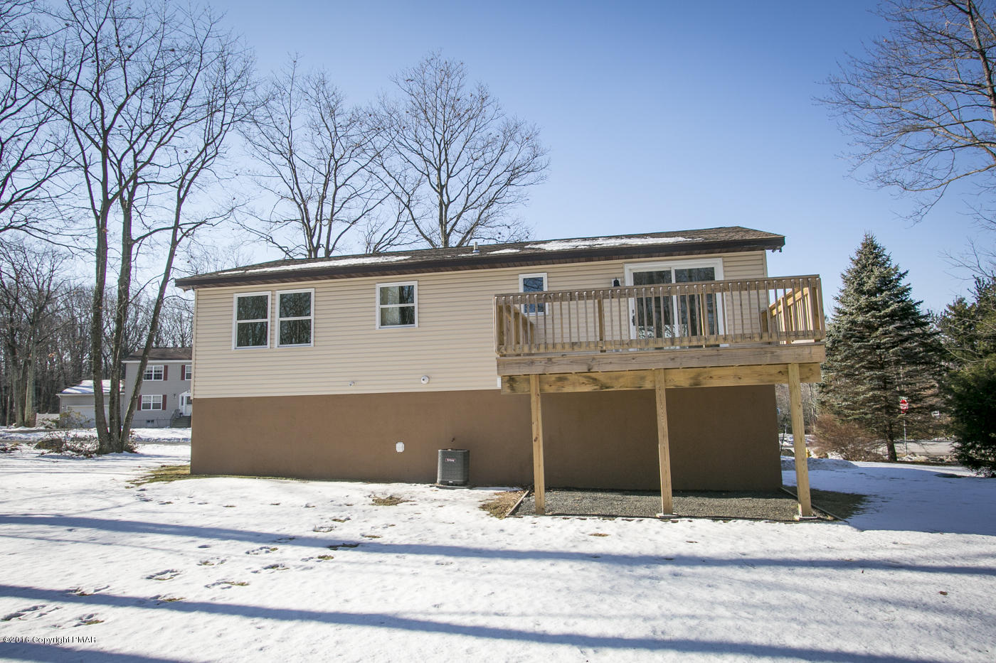 20 Cedar Road Mount Pocono, PA 18344 - Photo 4 of 43 a front view of a house with a yard covered in snow