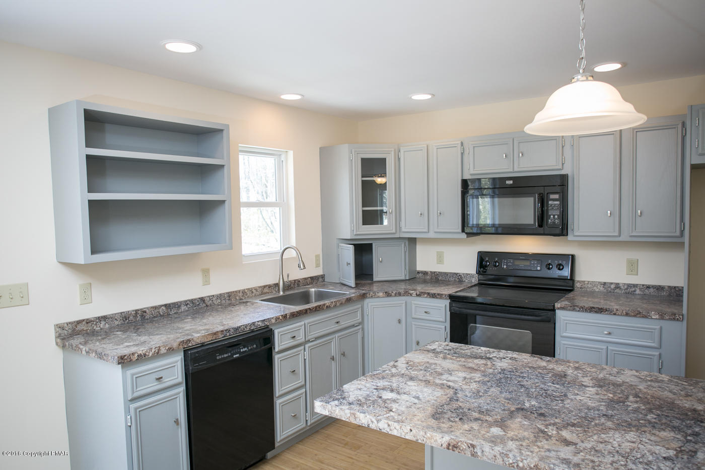20 Cedar Road Mount Pocono, PA 18344 - Photo 10 of 43 a kitchen with stainless steel appliances granite countertop a stove a sink and a microwave