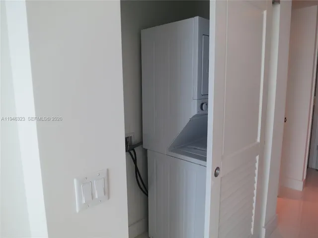 a view of kitchen and kitchen with a sink