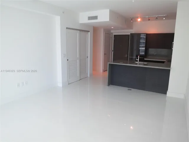 a picture of a bathroom with a shower